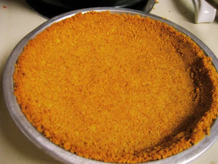 The image you uploaded appears to show a close-up of a graham cracker crust in a round baking dish.