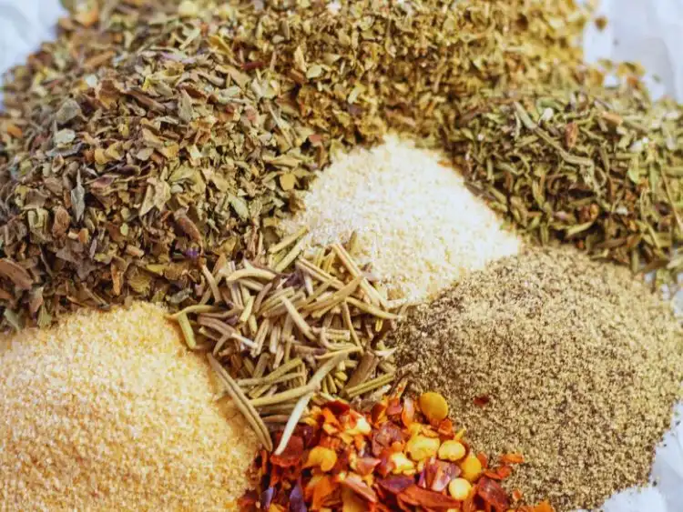 The image shows a variety of spices and seasonings that are commonly used for pasta dishes.