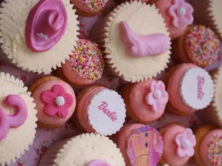 The image shows a collection of cupcakes with various decorations.