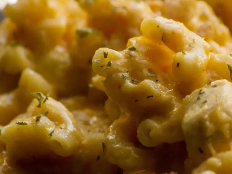 a creamy pasta dish, possibly macaroni and cheese, given its classic creamy yellow color